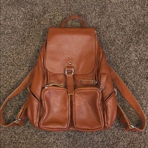 brown leather backpack